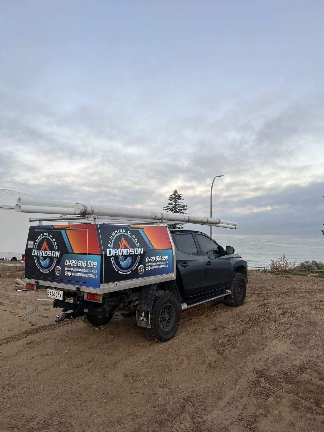 Branded Davidson Plumbing and Gas work ute on the South Australian coast