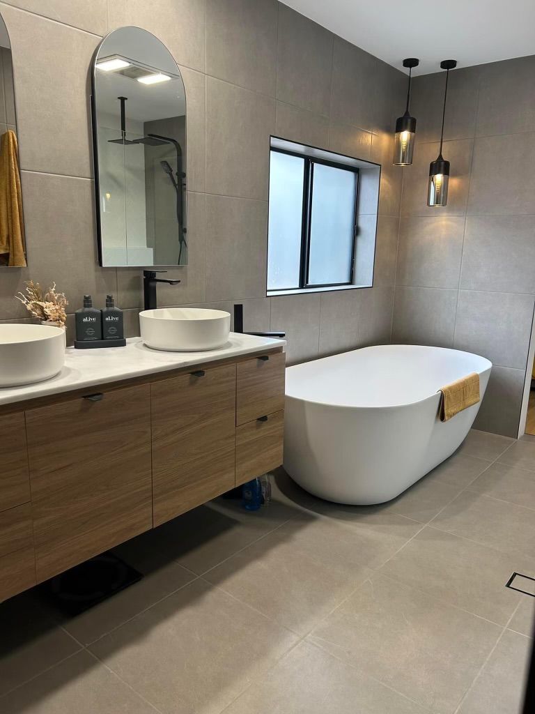 Bathroom renovation with freestanding bath and double vanity — Davidson Plumbing and Gas