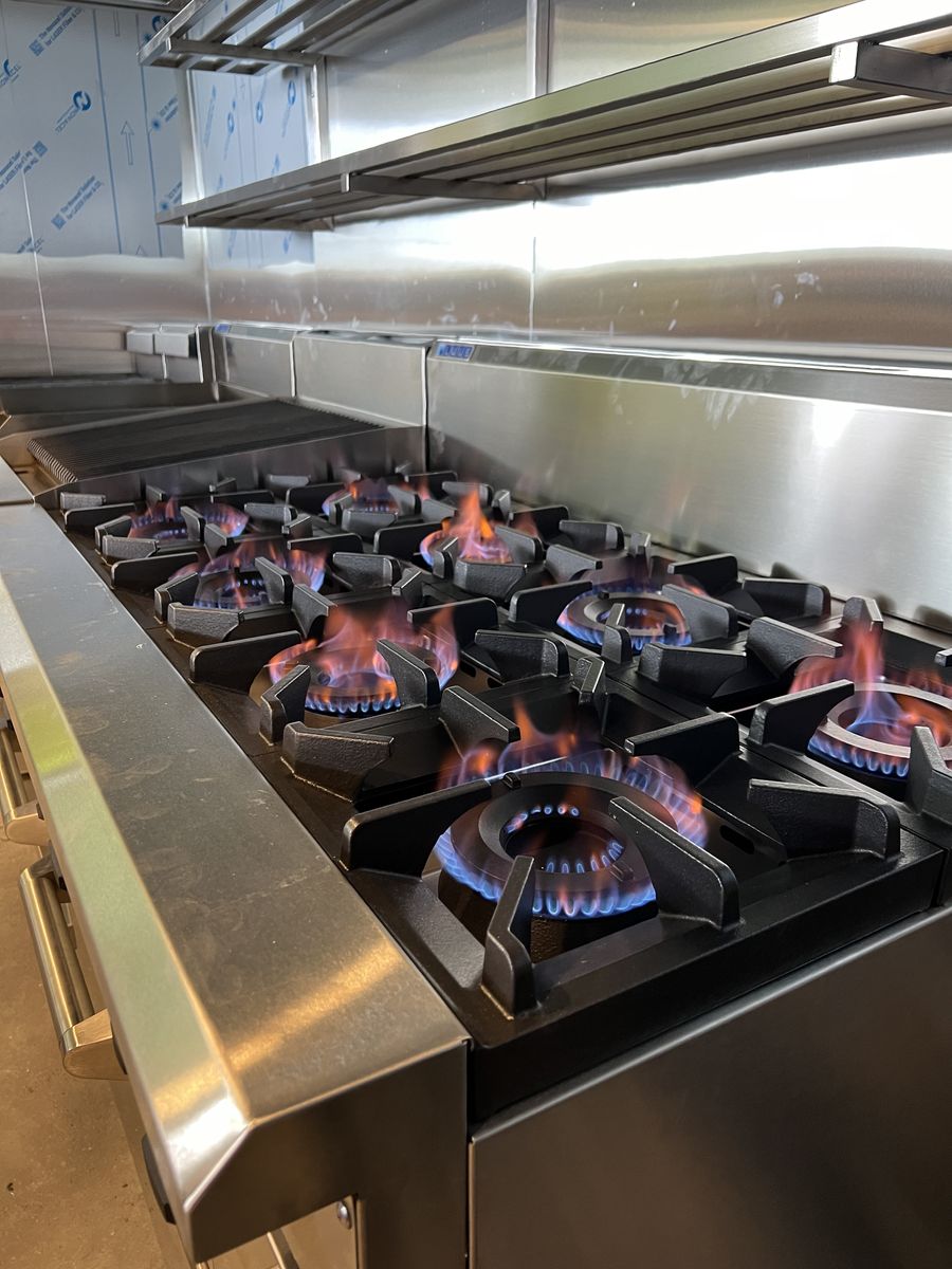 Gas cooktop burners alight after a Davidson Plumbing and Gas installation