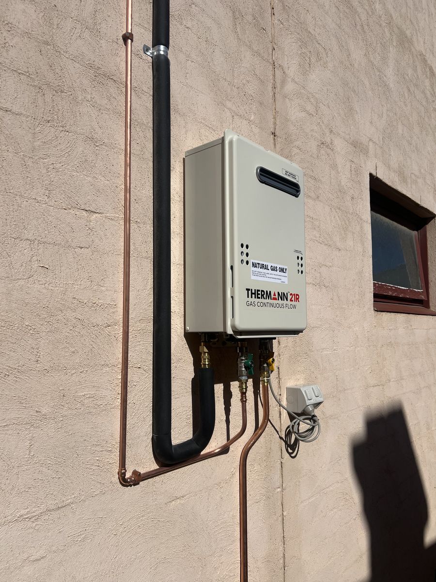 Wall-mounted gas continuous-flow hot water unit installed by Davidson Plumbing and Gas