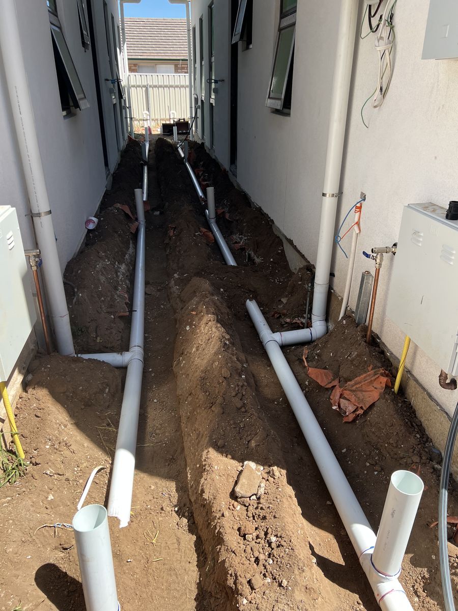 Stormwater drainage pipes laid in a trench by Davidson Plumbing and Gas