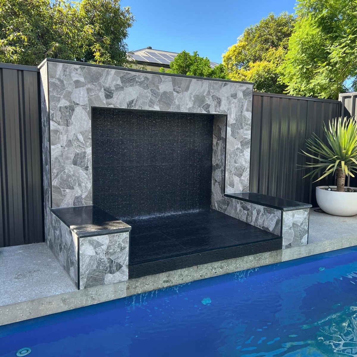 Poolside water feature wall installation — Davidson Plumbing and Gas